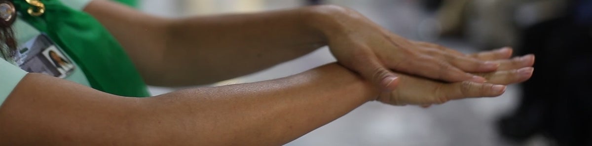 woman who disinfects her hands